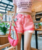 地球店粉色爱心图案，翻边牛仔短裤女夏季高腰小众设计感a字短裤子