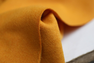 日本进口细腻温润暖和香橙色针织羊毛羊绒面料设计师连衣裙布料