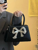 今年流行蝴蝶结手提包包女士2024潮高级感时尚小众设计斜挎包