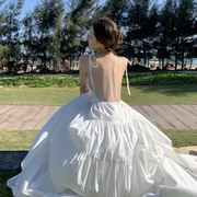 三亚巴厘岛海边度假大露背沙滩裙深V吊带连衣裙蛋糕超仙白色长裙