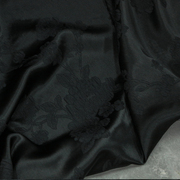 碳黑色真丝冠乐绉弹力提花布料浮雕褶皱桑蚕丝服装旗袍面料