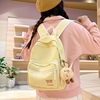 日常出行小背包女士2024奶黄色双肩包外出旅游简约纯色小书包